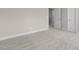 A bright bedroom with neutral carpet and an open doorway at 32 Iroquois Ct, Garner, NC 27529