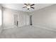 View of a large bedroom with neutral walls, plush carpet, and an ensuite bathroom at 32 Iroquois Ct, Garner, NC 27529