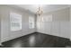 Dining room with white walls, dark wood floors, and ample natural light at 32 Iroquois Ct, Garner, NC 27529