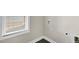 Convenient laundry area with natural light streaming through the window at 32 Iroquois Ct, Garner, NC 27529