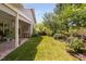 A beautiful backyard features lush green grass and a charming patio area for relaxing and entertaining at 323 Rosedale Creek Dr, Durham, NC 27703