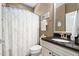 Bathroom with vanity featuring a dark countertop, a toilet, and a shower with a white curtain at 323 Rosedale Creek Dr, Durham, NC 27703