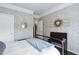 Bedroom with patterned wallpaper, an iron bed frame, and hardwood floors at 323 Rosedale Creek Dr, Durham, NC 27703