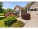 Beautiful home with well-maintained front yard landscaping, featuring a variety of colorful plants and bushes at 323 Rosedale Creek Dr, Durham, NC 27703