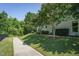 Charming home exterior with well-manicured lawn and flowering trees, creating a serene and inviting curb appeal at 323 Rosedale Creek Dr, Durham, NC 27703