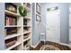 Hallway with built-in shelving, decorative items, and artwork at 323 Rosedale Creek Dr, Durham, NC 27703