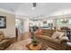 Spacious living room with open floor plan view of the kitchen, hardwood floors, and neutral walls at 323 Rosedale Creek Dr, Durham, NC 27703