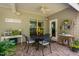 Covered patio featuring a dining table with chairs and charming decor for an inviting outdoor space at 323 Rosedale Creek Dr, Durham, NC 27703