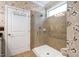 Bathroom with a glass-enclosed shower with neutral tiling and a convenient grab bar at 323 Rosedale Creek Dr, Durham, NC 27703