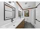 Contemporary bathroom featuring a double vanity, framed mirrors, and modern fixtures at 3412 Paddock Cir, Raleigh, NC 27613