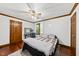Bedroom features hardwood floors, ceiling fan, and an adjacent study area at 3412 Paddock Cir, Raleigh, NC 27613