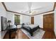 Bedroom features hardwood floors, ceiling fan, and an adjacent study area at 3412 Paddock Cir, Raleigh, NC 27613