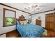 Bedroom features hardwood floors, ceiling fan, and lots of natural light at 3412 Paddock Cir, Raleigh, NC 27613