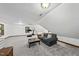 Spacious bonus room with plush carpet, ample lighting, and a cozy sitting area at 3412 Paddock Cir, Raleigh, NC 27613
