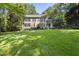 Traditional two-story home showcasing a well-manicured lawn, elegant landscaping, and inviting curb appeal at 3412 Paddock Cir, Raleigh, NC 27613