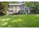Attractive two-story home with dark shutters, well-kept lawn, and professional landscaping at 3412 Paddock Cir, Raleigh, NC 27613