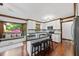 Bright kitchen with granite counters, stainless appliances, and a cozy breakfast nook at 3412 Paddock Cir, Raleigh, NC 27613