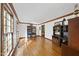 Bright living room with hardwood floors, trim, and large window overlooking the front yard at 3412 Paddock Cir, Raleigh, NC 27613
