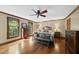 Spacious primary bedroom with hardwood floors, ceiling fan, and natural light at 3412 Paddock Cir, Raleigh, NC 27613