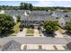 A peaceful street showcasing townhomes, manicured lawns, and convenient parking at 3526 Londonville Ln, Raleigh, NC 27604