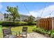 Serene backyard with lush lawn, string lights, and patio furniture, perfect for outdoor relaxation at 3526 Londonville Ln, Raleigh, NC 27604