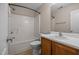 Bright bathroom featuring a sink, mirror, toilet, and shower-tub combo at 3526 Londonville Ln, Raleigh, NC 27604