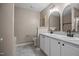 Bathroom featuring a double sink vanity, tile floor, and modern fixtures at 3526 Londonville Ln, Raleigh, NC 27604