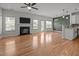 An open-concept living room features hardwood floors, a fireplace, and lots of natural light at 3526 Londonville Ln, Raleigh, NC 27604