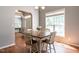 Bright dining area featuring wood floors, a table with seating for four, and natural light at 3709 Andoversford Ct, Wake Forest, NC 27587