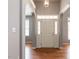 Inviting foyer with hardwood floors, arched doorways and a front door with sidelights at 3709 Andoversford Ct, Wake Forest, NC 27587