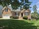 Charming brick home with well-manicured lawn, attached garage and beautifully landscaped front yard at 3709 Andoversford Ct, Wake Forest, NC 27587