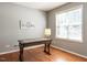 Cozy home office with wood floors, natural light, and a wooden desk at 3709 Andoversford Ct, Wake Forest, NC 27587
