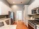 Kitchen with stainless steel appliances, granite counters, tile backsplash, and hardwood floors at 3709 Andoversford Ct, Wake Forest, NC 27587