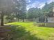 Backyard featuring a lawn and a wooden deck at 408 Greenfern Ct, Burlington, NC 27215