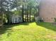 Backyard featuring a lawn and a shed at 408 Greenfern Ct, Burlington, NC 27215