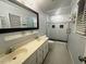 Bathroom featuring a double vanity, glass shower, and tiled floors at 408 Greenfern Ct, Burlington, NC 27215