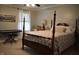 Bedroom featuring a four poster bed, neutral walls, and a piano at 408 Greenfern Ct, Burlington, NC 27215