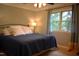 Bedroom features a full size bed with cozy bedding, a window, and neutral colored walls at 408 Greenfern Ct, Burlington, NC 27215