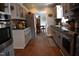 Well-equipped kitchen with granite countertops, stainless steel appliances, and ample storage space at 408 Greenfern Ct, Burlington, NC 27215