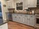 This kitchen features granite counters, stainless appliances and plenty of cabinet storage at 408 Greenfern Ct, Burlington, NC 27215