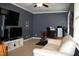 Modern living room with carpet and multiple televisions in media setup at 408 Greenfern Ct, Burlington, NC 27215