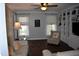 Bright and airy living room boasting a ceiling fan, beautiful hardwood floors, and elegant decor at 408 Greenfern Ct, Burlington, NC 27215