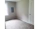 Neutral bedroom with a window for natural light and carpet flooring at 4112 Forrest Ave, Efland, NC 27243