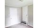 Standard bedroom with two doors and carpet flooring at 4112 Forrest Ave, Efland, NC 27243