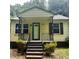 Charming home exterior with welcoming front porch and classic design elements at 4112 Forrest Ave, Efland, NC 27243