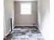 Laundry room features vinyl tile floor and window at 4112 Forrest Ave, Efland, NC 27243