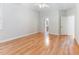 Bedroom featuring hardwood floors, ceiling fan, and an ensuite bathroom at 4305 Heathgate Ln, Raleigh, NC 27613