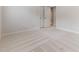 Spacious bedroom featuring neutral carpeting, white walls, and a double door closet at 4305 Heathgate Ln, Raleigh, NC 27613