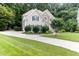 Charming two-story home featuring stone accents and a well-manicured lawn at 4305 Heathgate Ln, Raleigh, NC 27613