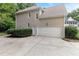 Spacious garage with ample parking space and a well-maintained driveway at 4305 Heathgate Ln, Raleigh, NC 27613